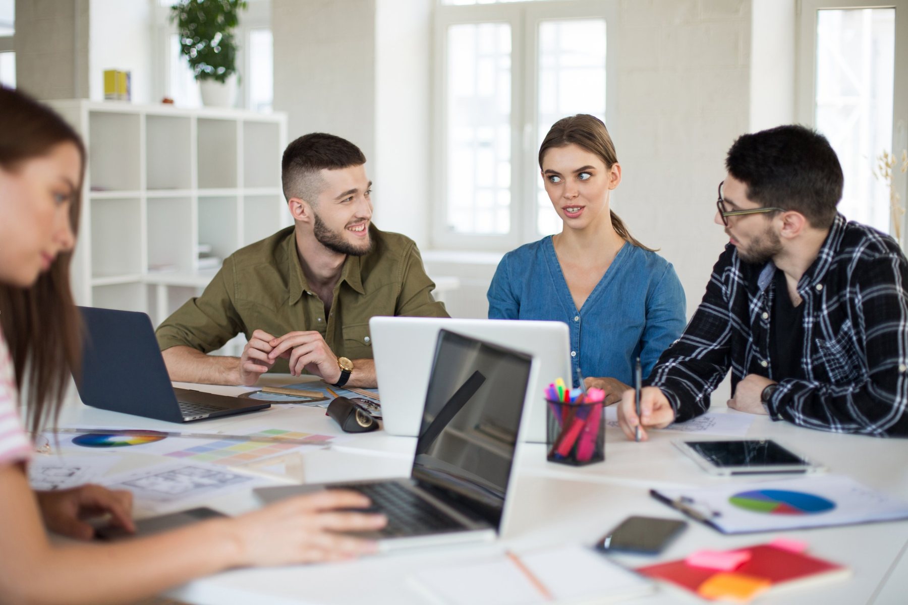 A marketing team planning a campaign around a shared table